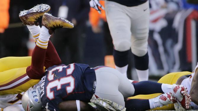 FILE- In this Sunday, Nov. 9, 2015, file photo, New England Patriots running back Dion Lewis lands on the turf during a play when he was injured during the second half of an NFL football game against the Washington Redskins in Foxborough, Mass. Lewis left in the third quarter with a knee injury. (AP Photo/Steven Senne, File)