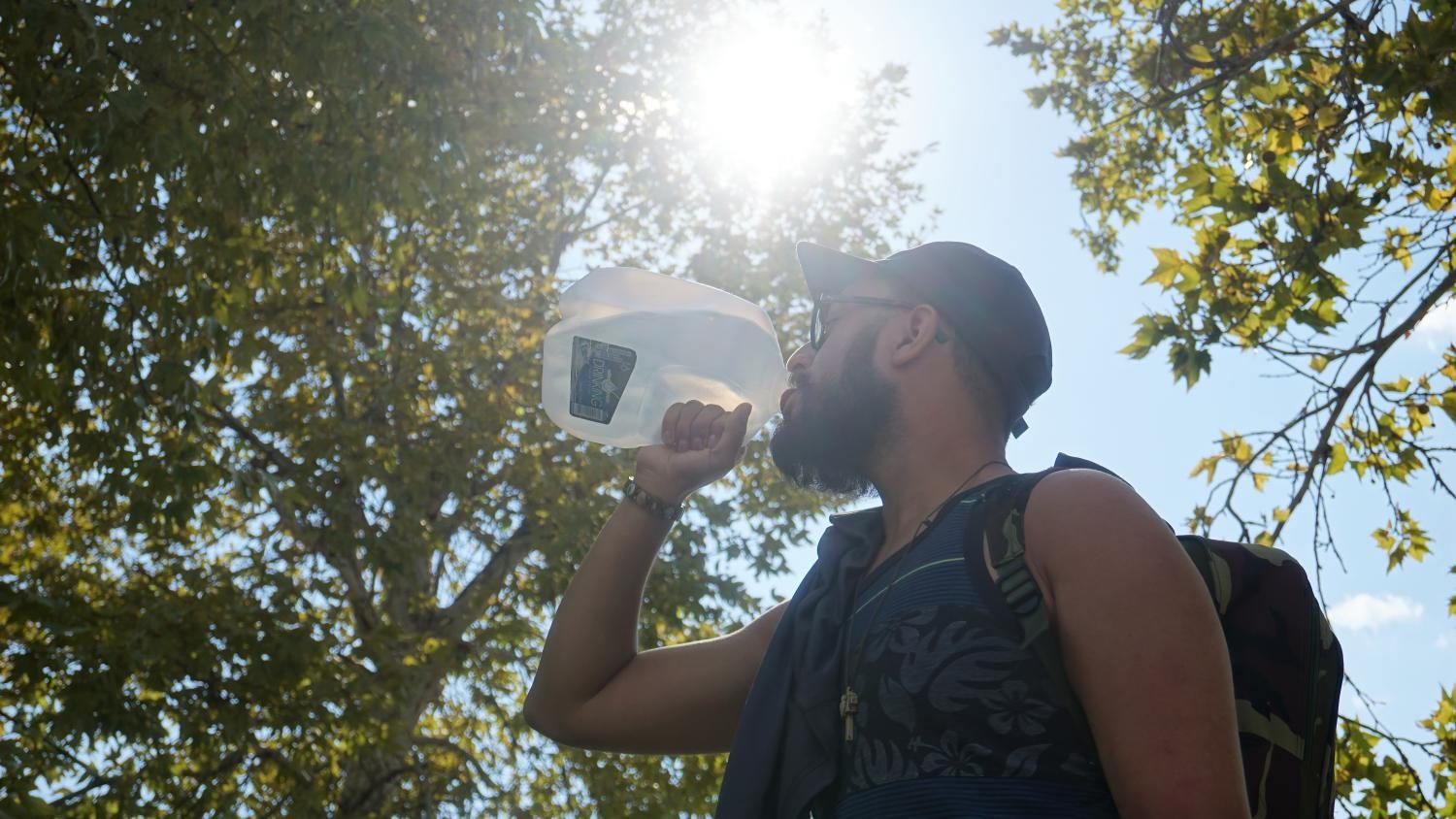 NMSU student trying to stay hydrated in these high tempuratures while walking to class.
