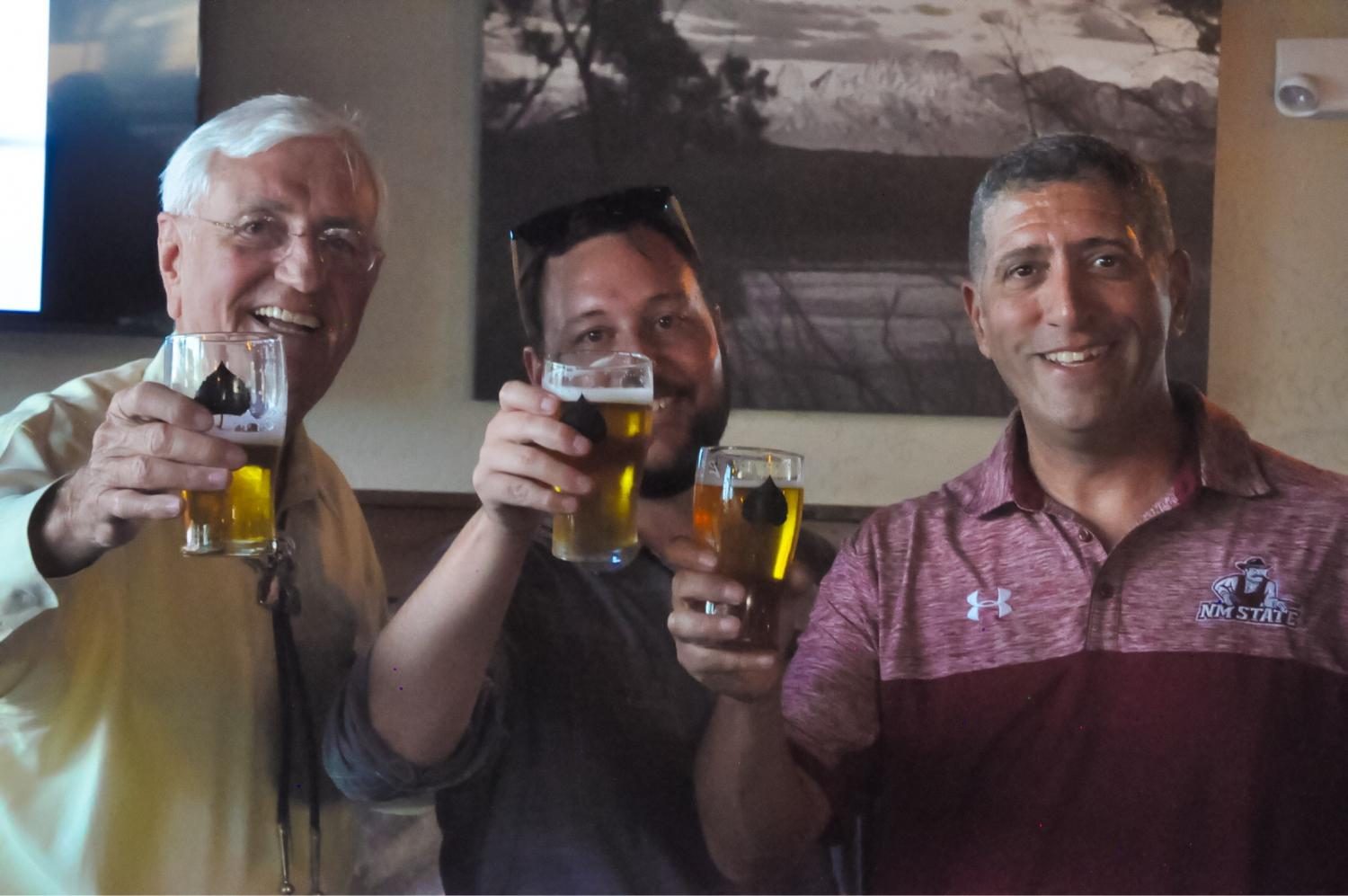 NMSU President Garrey Carruthers (Left), Bosque Managing Director Gabe Jensen, and Athletic Director Mario Moccia pose on Thursday as the University announced a partnership that includes their own, branded, beer. 