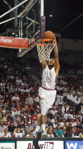#35 Johnny McCants dunking the ball following a steal.
