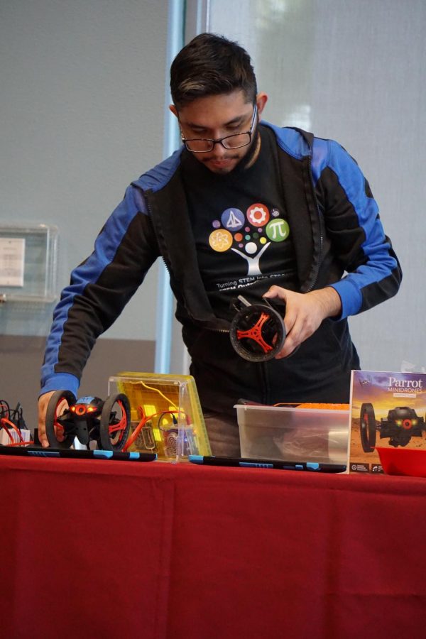 Mario Garcia of the STEM Outreach  Center preparing the Parrot Mini drones