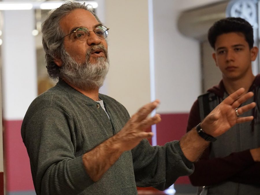 A faculty member speaking to students about life on the NMSU campus