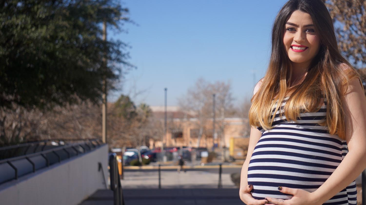 Zeylah Galindo, a student at NMSU, poses with her baby bump. Galindo is due to give birth next month.