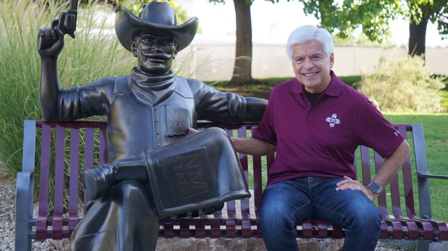Chancellor Arvizu poses with the new Pistol Pete bronze sculpture outside Corbett Center during its unveiling Wednesday morning. 