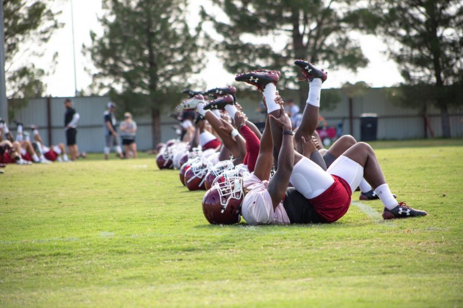 New Mexico State Football team warming up before their practice