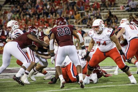 Aggie offense catches fire, downs Liberty 49-41