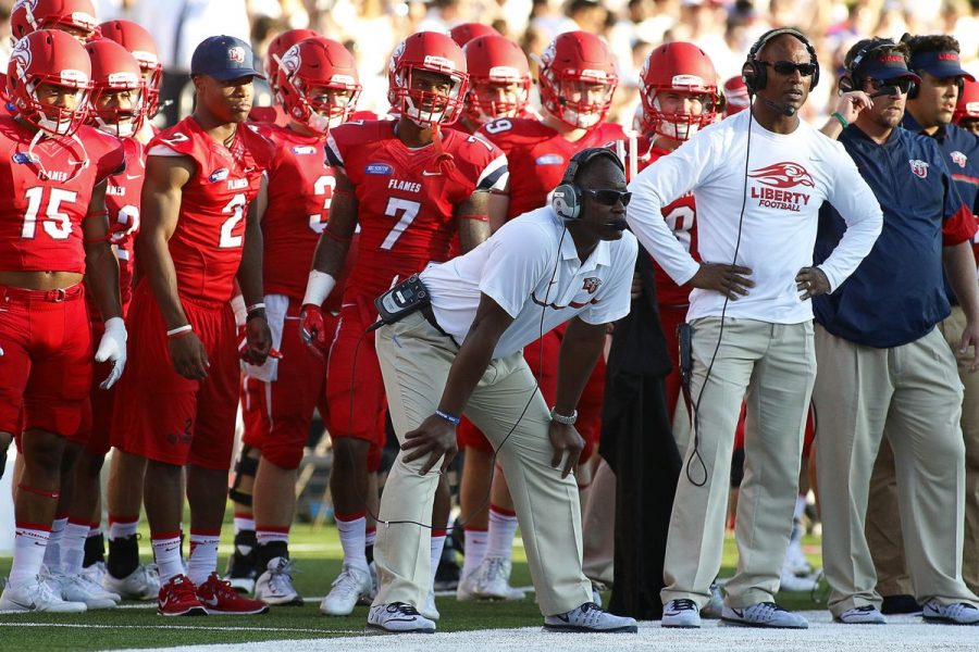 Liberty head football coach Turner Gill has led the Flames into FBS relevance. They will face NMSU Saturday night at 6 p.m. inside Aggie Memorial Stadium. 