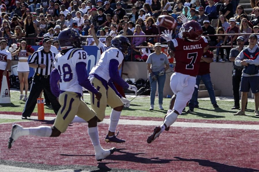 Royce Caldwell snags a corner-of-the-end zone touchdown in the first quarter of his final game at Aggie Memorial.
