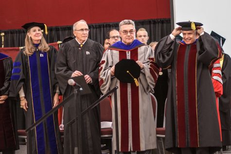 President John D. Floros and Chancellor Dan Arvizu stand with colleagues wearing Academic Regalia at NMSU inauguration.