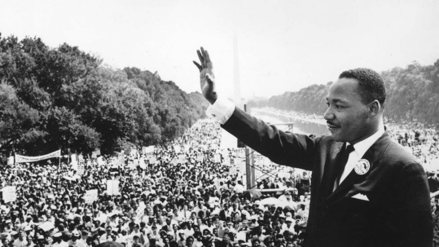 Dr. Martin Luther King  Jr. acknowledges crowd after his famous I Have a Dream speech at Washington D.C.s Lincoln Memorial. 