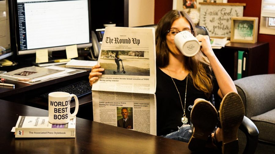 Ready for a new year, Alanna Herrera clutches a new Girl Boss mug while reading her favorite publication.