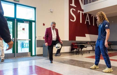 NMSU President John Floros juggles a soccer ball prior to the university announcing the establishment a developmental men’s soccer program at the university. (NMSU photo by Josh Bachman)