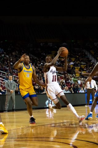 Jabari Rice drives to the hoop in the Aggies' 61-57 win over CSU Bakersfield.