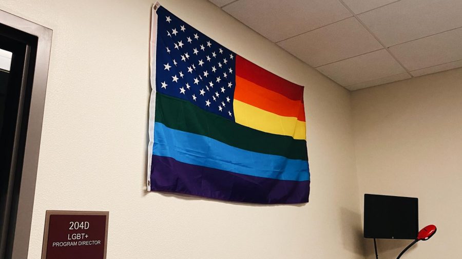 A Pride flag is pictured outside the LGBT Programs office. 