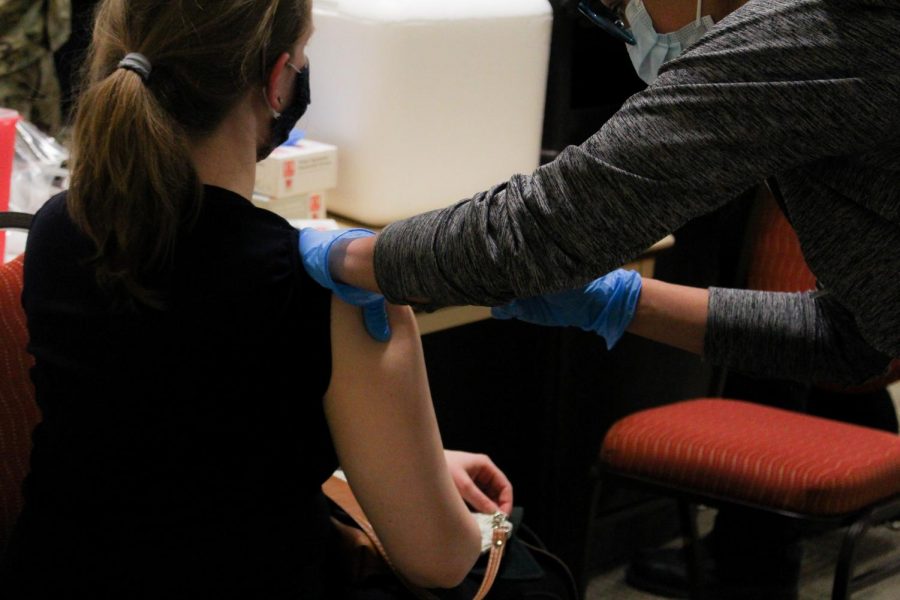 A woman receives a COVID-19 Vaccination at the Las Cruces Convention Center Jan. 27, 2020.