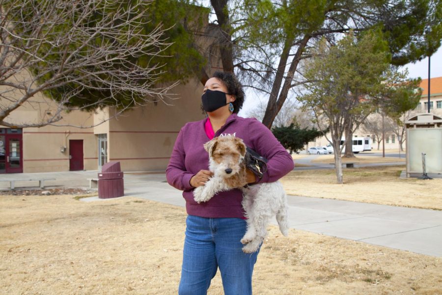 Angela Owens, newly hired director of Glass Family Research Institute for Early Childhood Studies, holds Samson the dog, associated with Guide Dogs for the Blind NMSU Community Puppy Raisers