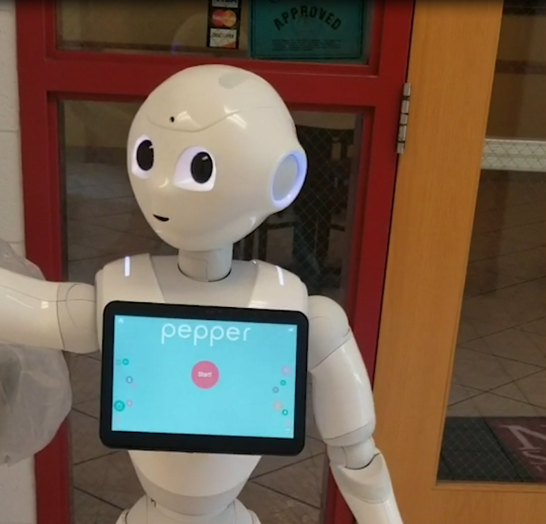 NMSU Robot Pepper interacts with patrons heading into the 100 West Cafe at NMSU. (Courtesy Andrea Arrigucci)