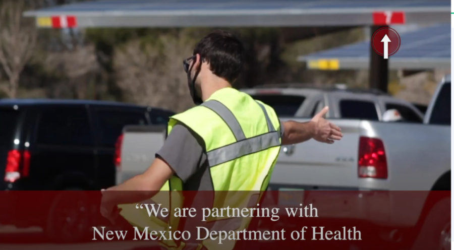 A volunteer directs traffic at the NMSU vaccination center on Friday, March 5, 2021.