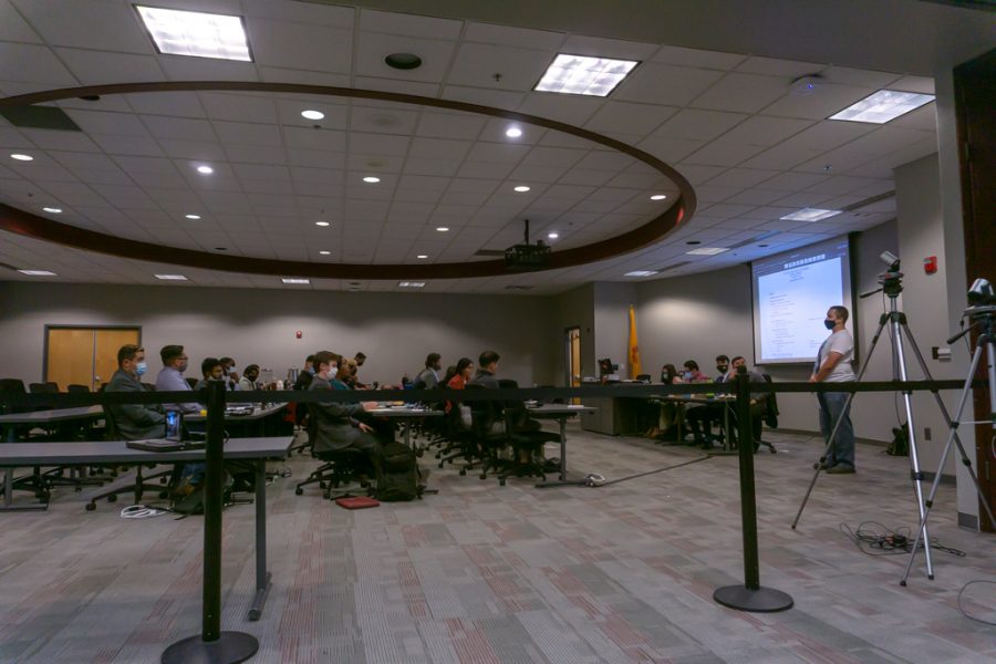 ASNMSU Senate hears out graduate student, Bryson Stemock, during open forum.