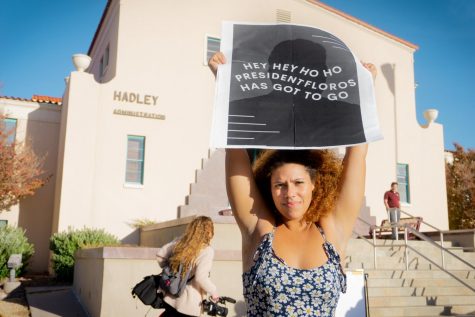Virginia Phillips, an NMSU student protests outside Hadley Hall on Nov. 16.