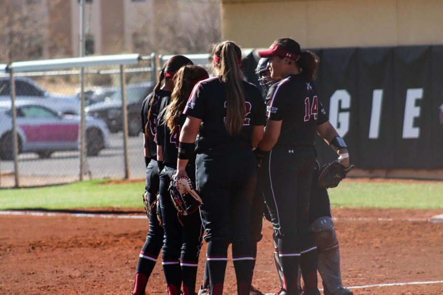New Mexico State University softball team getting ready for outfield defense.