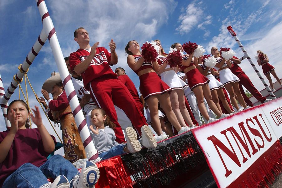NMSU+cheerleaders+ride+down+University+Avenue+in+the+annual+homecoming+parade.+%28photo+by+Darren+Phillips%29