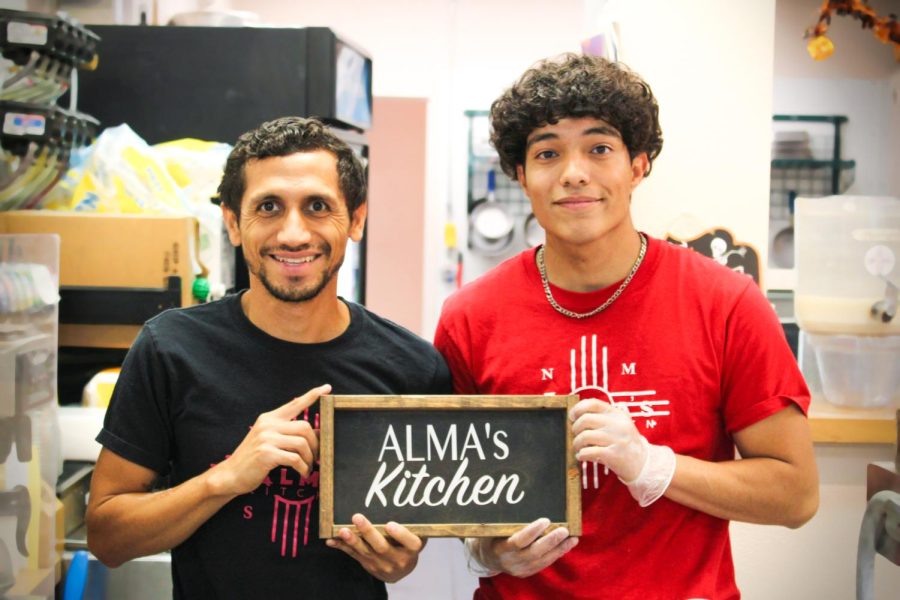 Arik Ruiz (left) and Robert Espinosa (right) welcome customers to Alma’s Kitchen on. Oct. 7, 2022. 