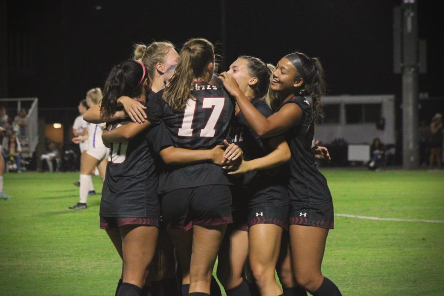The+Aggies+celebrate+with+a+tight+hug+after+Midfielder+Brooke+Schultz+scores+against+TSU.+Sept.+30%2C+2022.