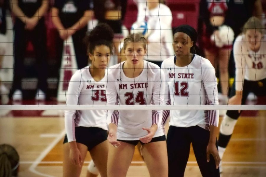 The Aggies prepare themselves to defend their side of the court against Chicagos serve on Wednesday Oct. 12, 2022. 