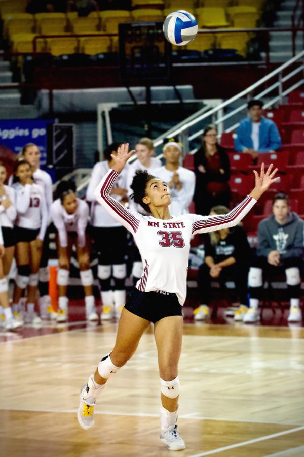 Outside hitter Mari Sharp serves the ball after the Aggies scored a point against the Cougars on Oct. 12, 2022. 