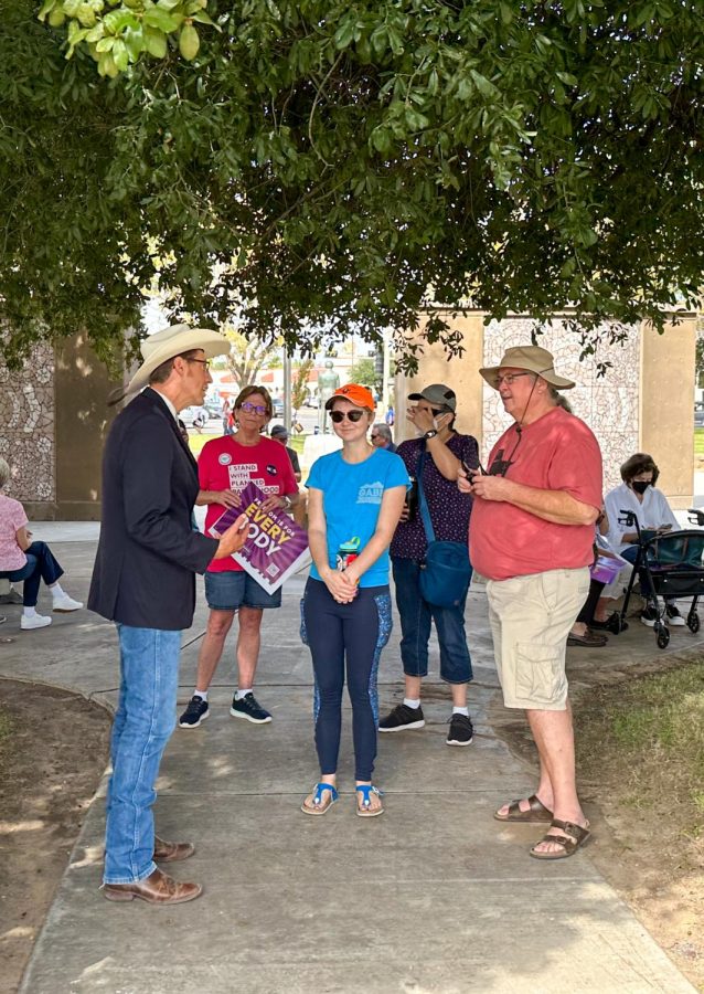 Candidate for re-election for State Legislature (Representative for District 36), Nathan Smalls speaks with people attending the Rally for Choice outside Thomas-Branigan Memorial Library on Oct. 15, 2022. 