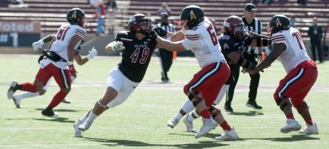 NMSU linebacker Gabe Peterson tries to get to the quaterback, fighting past a Lamar lineman during Saturdays game at Aggie Memorial Stadium on Nov. 12, 2022.