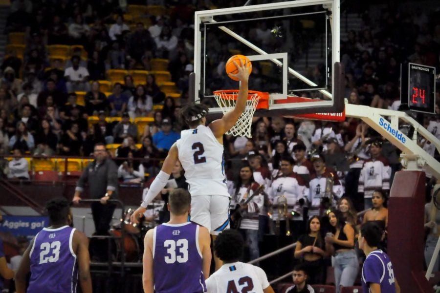 Issa Muhammad dunks a score against  New Mexico Highlands during Mondays game, Nov. 7, 2022, at the Pan American Center. 
