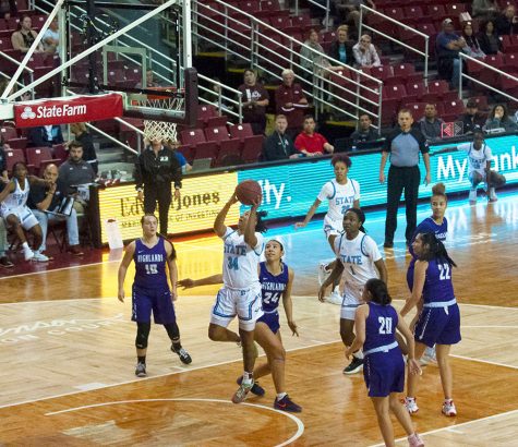 NMSU guard Tayelin Gray moves under the basket attempting a layup against New Mexico Highlands on Nov. 9, 2022.  