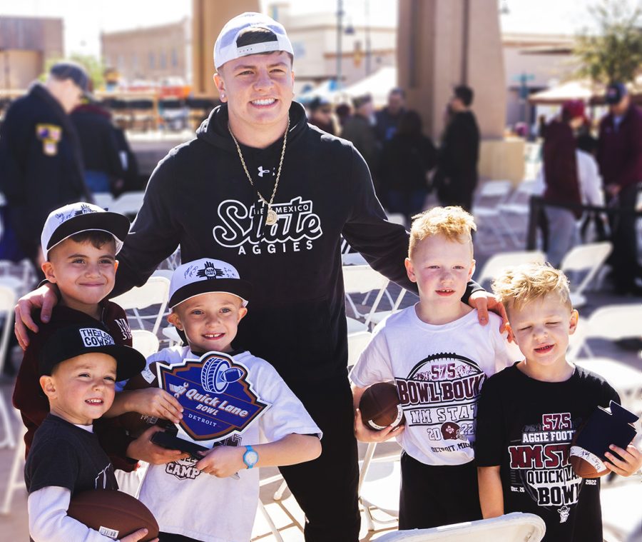 NMSU quarterback Diego Pavia taking picutres with young Aggie fans at the during its bowl celebration. Photo taken on Saturday Jan. 21, 2023. 