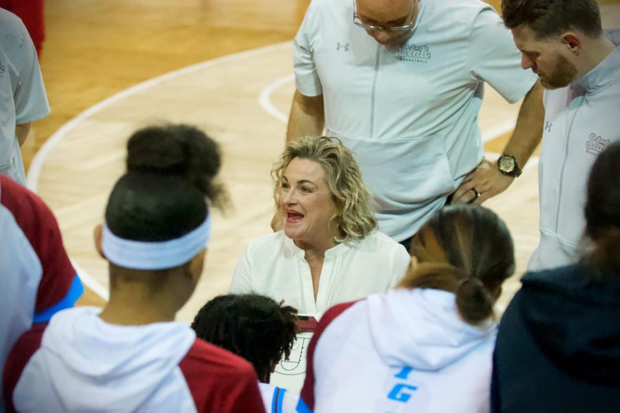 Head coach Jody Adams discusses plays with her team during a timeout late in Thursdays game against Abilene Christian at the Pan American Center on Jan. 26, 2022.  