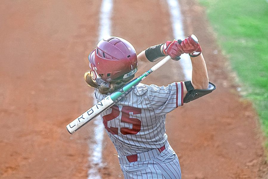 Utility Player Jillian Taylor winds up to swing the bat for the Aggies during Fridays game on Feb. 24, 2023.