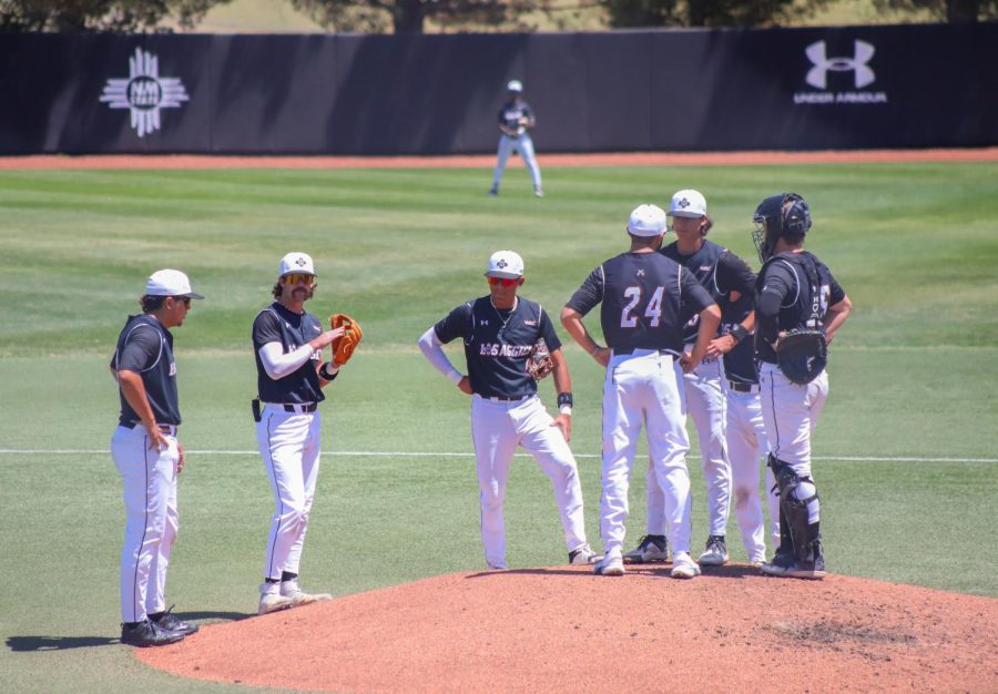 The+Aggies+gather+together+at+the+pitchers+mound+to+discuss+their+game+plan.+April+16%2C+2023.
