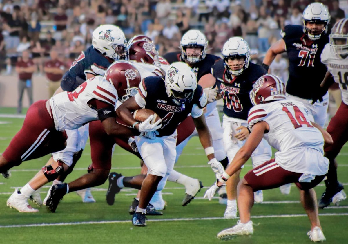 Running back Star Thomas makes his way through his UMASS opponents on Aug. 26, 2023. 