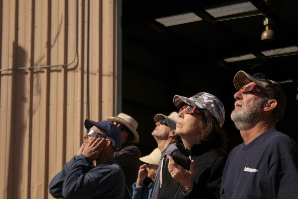 People gather to witness the solar eclipse as a community on Oct. 14, 2023