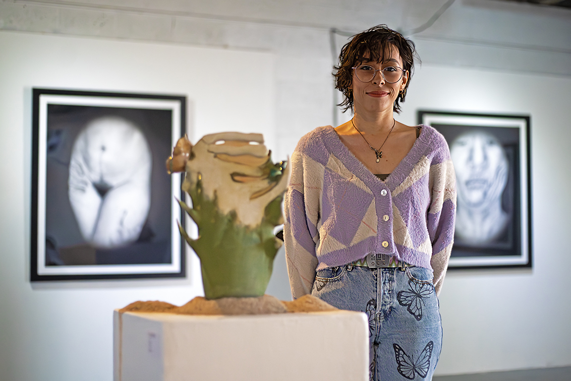 Susana Campos stands next to their art piece, Saturday, Nov. 4, 2023.