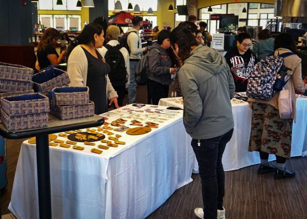 Students peruse jewelry stands at the 41st Annual Jewelry Sale Monday, Oct. 30, 2023. The jewelry was handmade and sold by several art students.