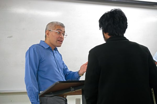 Neil Sinhababu, a professor of philosophy at the National University of Singapore, answers a question from an attendee after his talk Thursday, Jan. 25, 2024. 