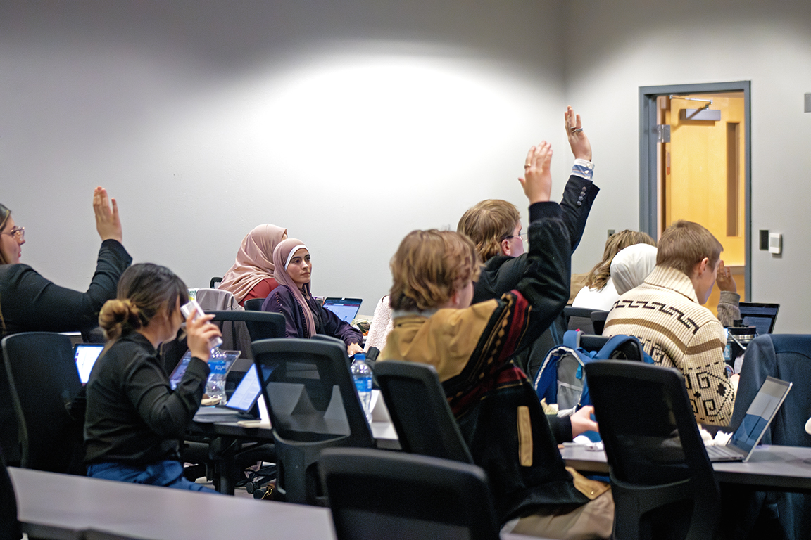 The ASNMSU senate raises their hands to vote during last Thursday’s meeting. Jan. 25, 2024.