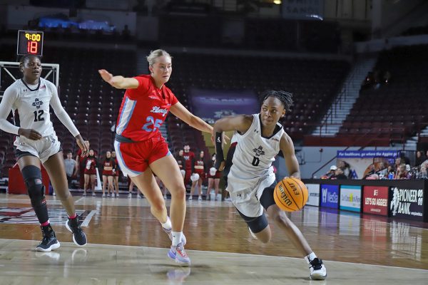 Guard Molly Kaiser pushes past the Liberty Flames on Feb. 29, 2024. 