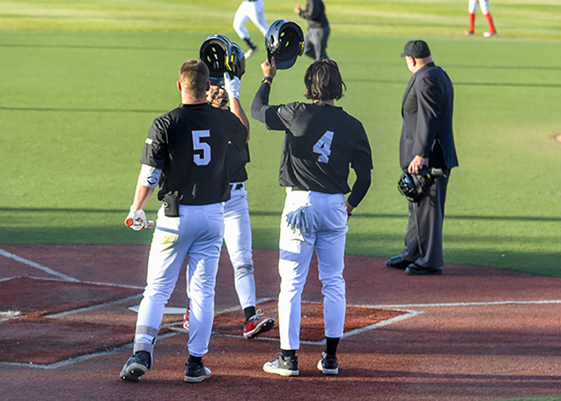 Sheehan OConnor and Titus Dumitru celebrate with teammate after a home run against UNM. April 9, 2024. 