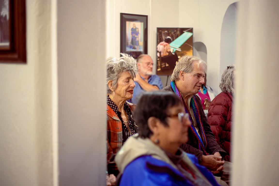 Attendees at Nopalitos Galería listen to the musical performance on March 8, 2024, “Songs in Cello and Cajon,” by Emma Alvarez de la Rosa and William Reeves. 
