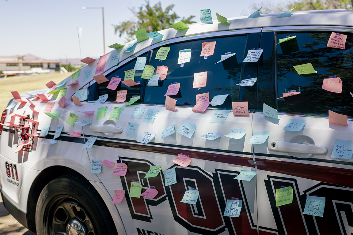 An+NMSU+police+cruiser+is+covered+in+colorful+sticky+notes+as+a+part+of+the+%E2%80%9CCover+the+Cruiser%E2%80%9D+event.+April+23%2C+2024.