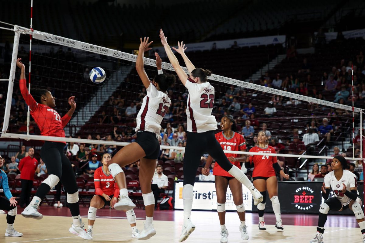 NMSU’s Mari Sharp and Nicole Briggs defend a spike from UNM’s Jada Bouyer on Thursday, Sept. 19, 2024. 