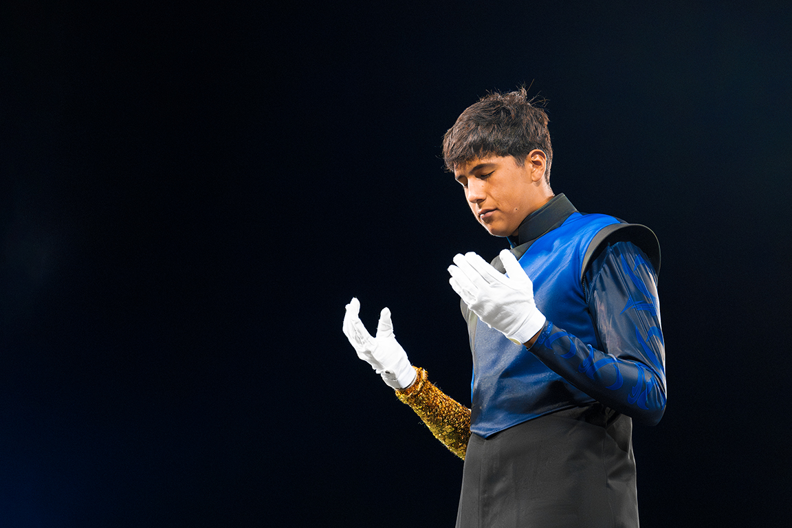 Head Drum Major, Leo Borroel, prays before Del Valle High School’s final performance of the night. Sept. 21, 2024.